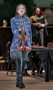 Kate Lindsey as Nicklausse with Paul Groves as Hoffmann in the background [Photo by Ken Howard courtesy of Santa Fe Opera]