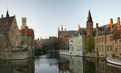 The Rozenhoedkaai [nl] (canal) in Bruges with the belfry in the background [Source: Wikipedia]