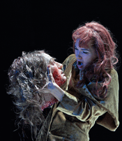 Kelly Kaduce as Salome shown with the head of Jokanaan [Photo by Ken Howard courtesy of Opera Theatre of Saint Louis]