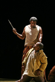 Gregg Baker (Cinque) and Fikile Mvinjelwa (Antonio) performing in Amistad at Spoleto Festival USA, May 22- June 8, 2008. Photo by WIlliam Struhrs.